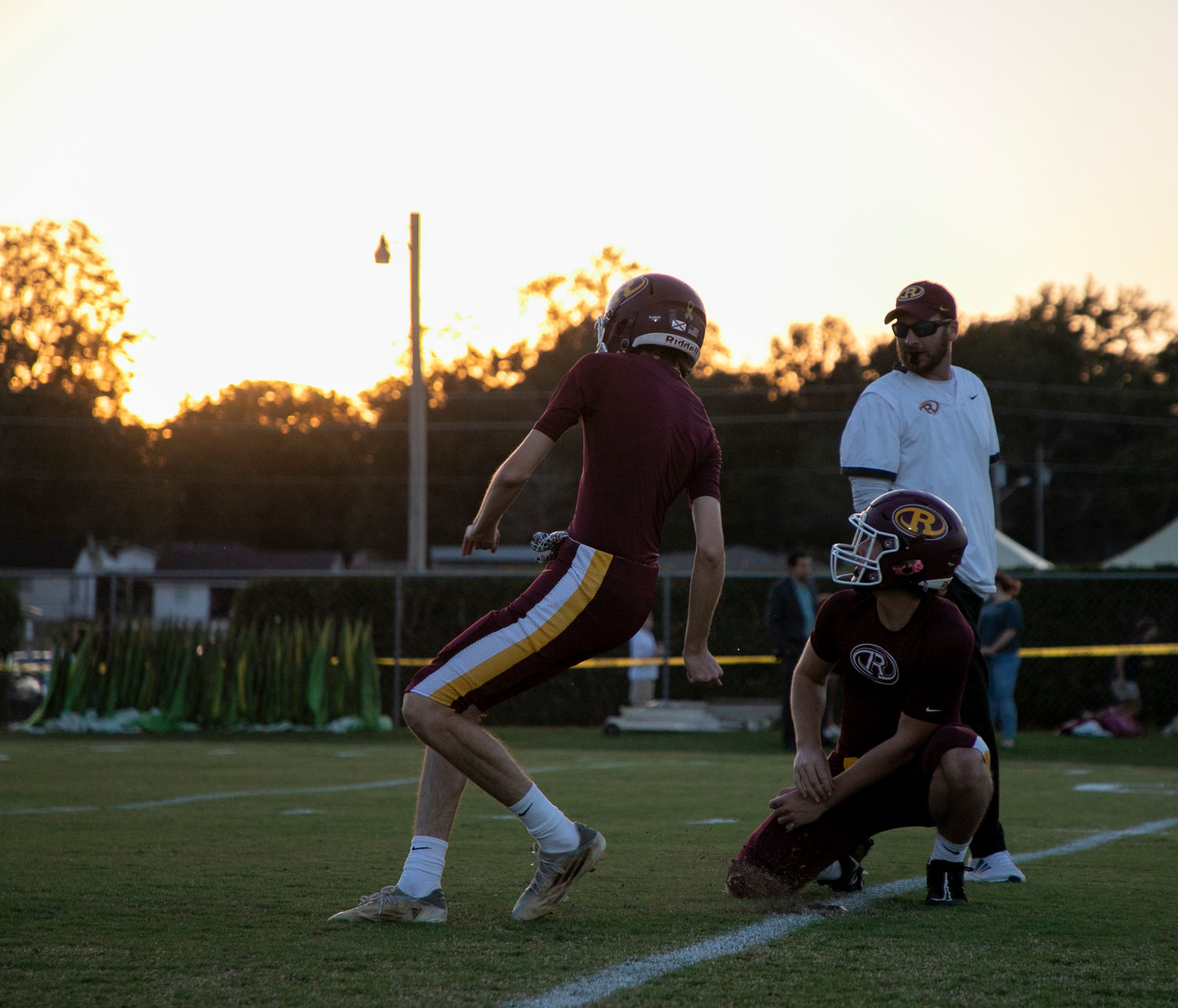 Golden Bears at the golden hour. Robertsdale specialists warm up for the Oct. 14 region battle against Spanish Fort at J.D. Sellars Stadium.