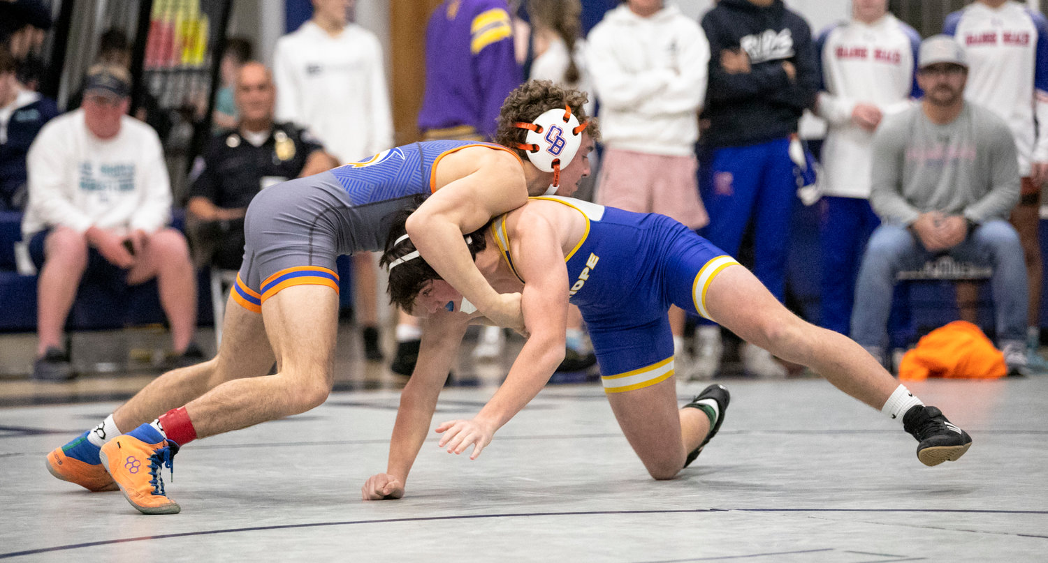 Orange Beach senior Shayd Arboneaux circles around Fairhope’s Cameron Bauer in the first round of the 132-pound class at Friday’s Baldwin County wrestling championship in Gulf Shores. Arboneaux, a Montevallo signee, claimed the county title for his fourth win of the season.
