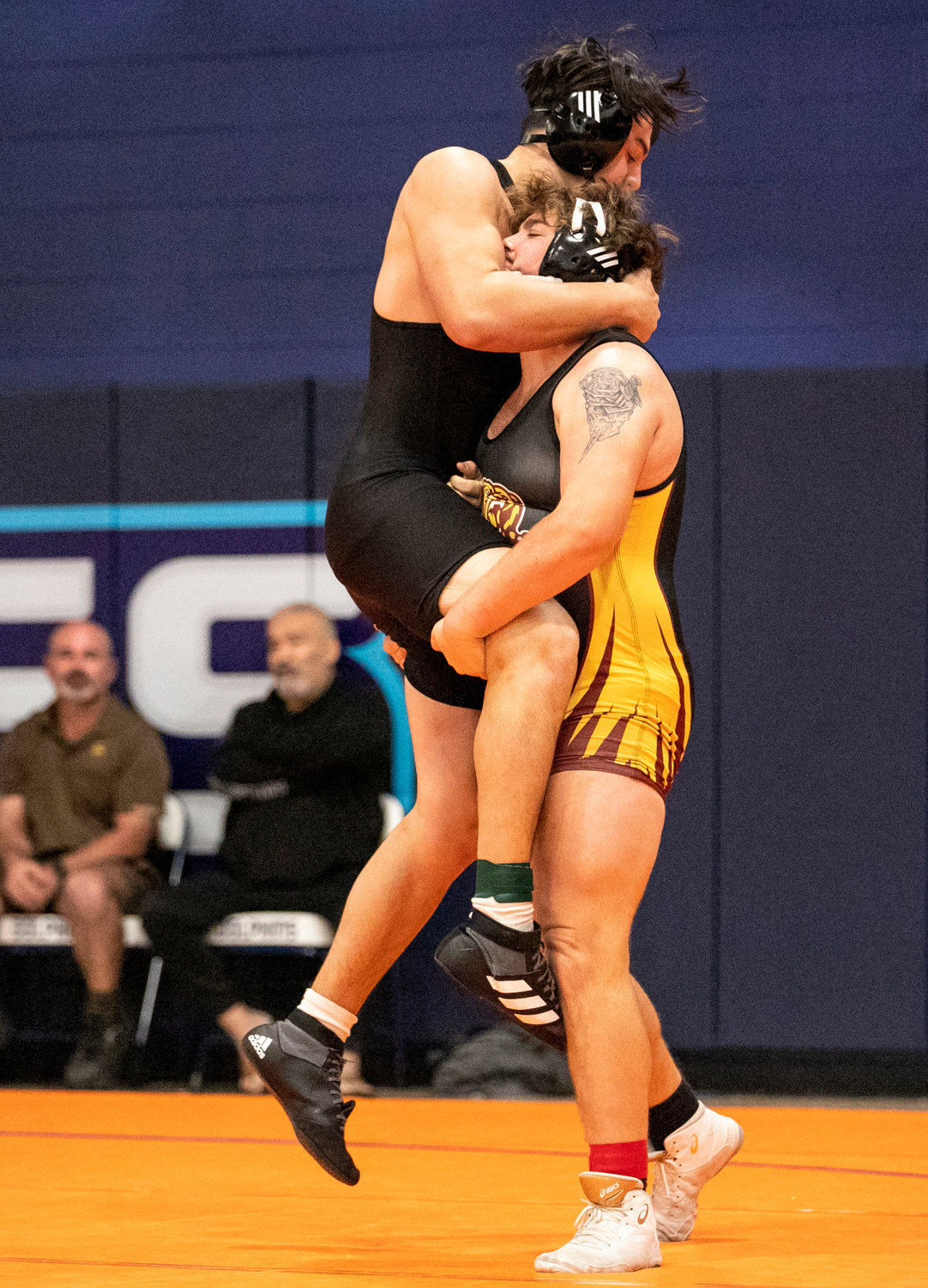 Caiden Arnold of Robertsdale lifts Elberta’s Eden Overstreet in the 220-pound quarterfinal match of the Baldwin County Championship meet Friday, Jan. 6, at Gulf Shores High School. Arnold finished second in the class to earn one of three all-county honors for the Golden Bears.