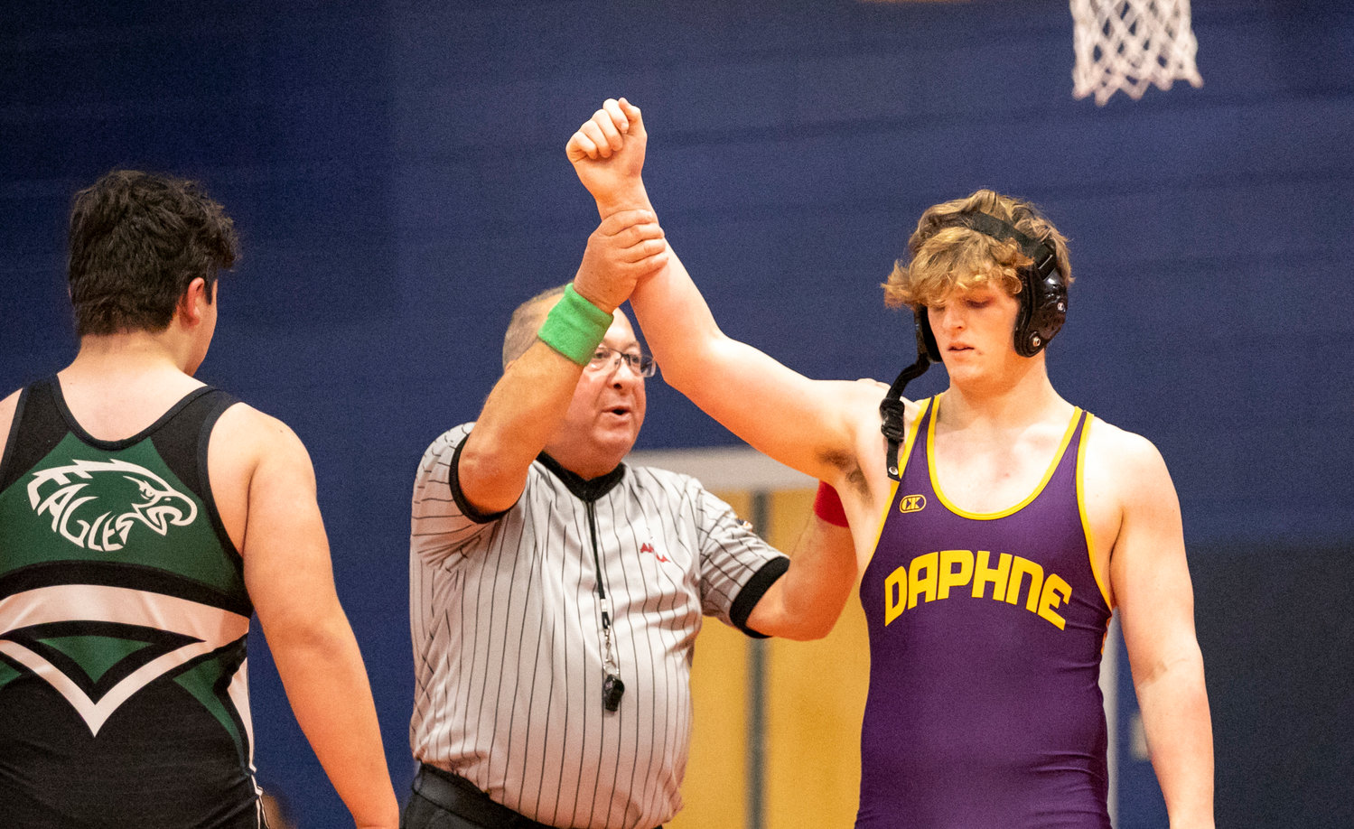 Daphne sophomore Colton Rainer claims victory in the quarterfinals of the 220-pound class at the Baldwin County Championship meet in Gulf Shores Friday, Jan. 6. Rainer was one of four individual champions to help the Trojans finish as team runners-up.