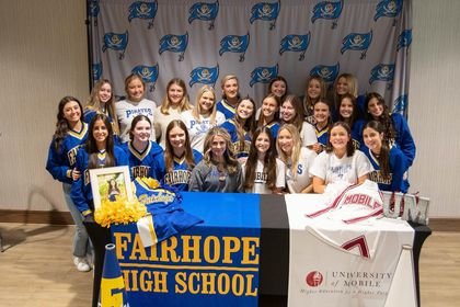 Michelle Bossard was joined by her teammates in celebrating her signing with the Mobile Ram cheerleading squad during a ceremony at First Baptist Church Friday, Jan. 6. After the Pirates won the Game Day division in Class 7A at the South Regional championship, Fairhope earned fourth place at the AHSAA state championship meet in December.