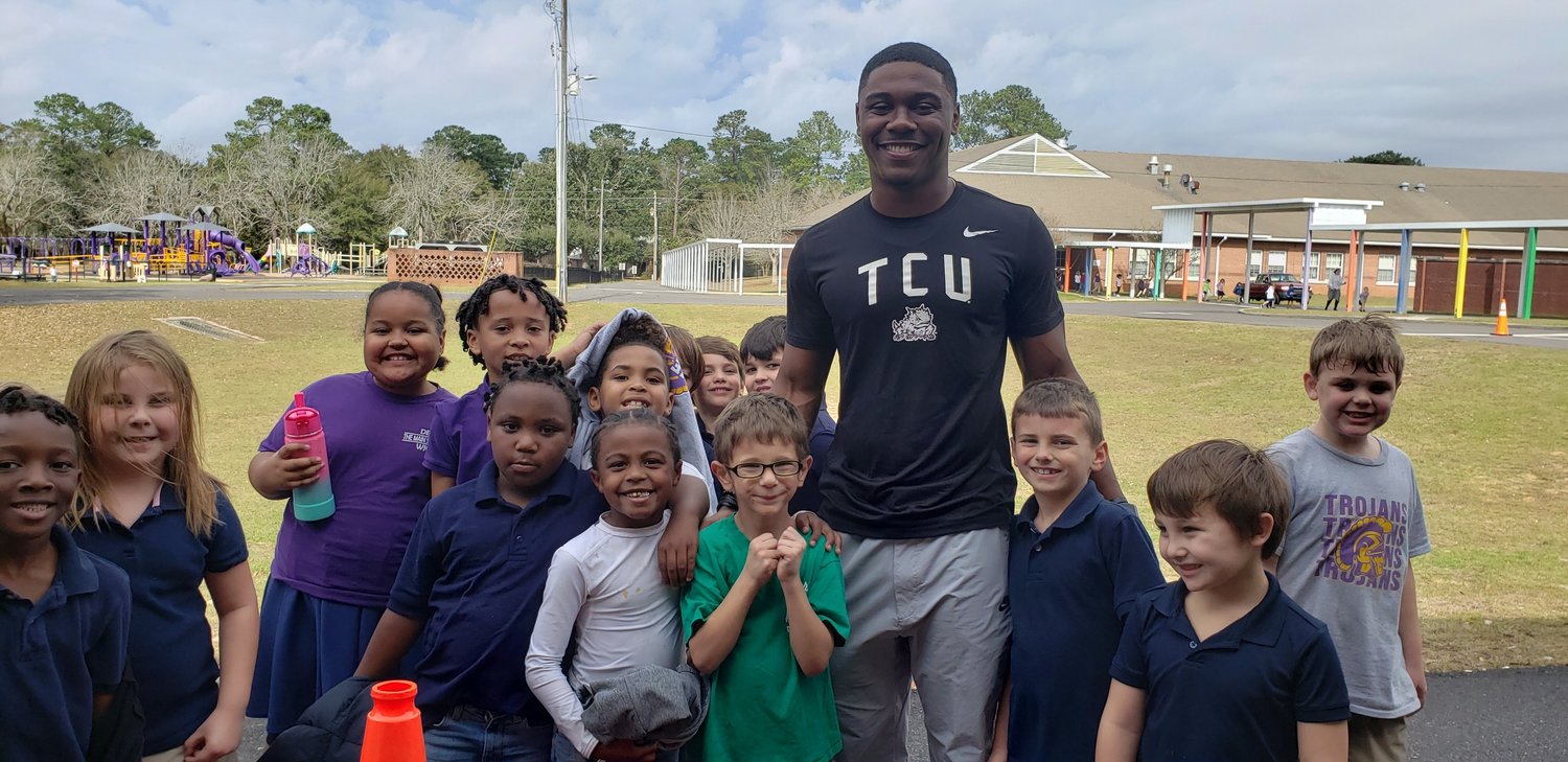 TCU running back and Daphne alumnus Trent Battle visited Daphne Elementary School this week while on break from school fresh off the national championship game. Battle became the third former Trojan to play for college football’s national title in the last 10 years.
