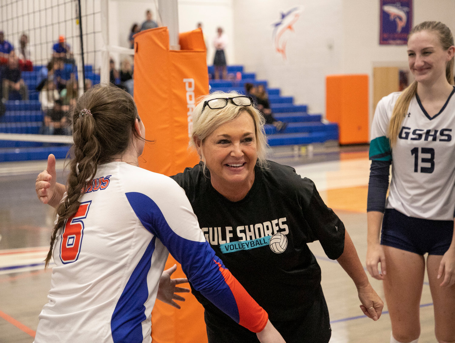 Former Gulf Shores head volleyball coach Karen Atkins embraces Orange Beach senior Leyni Young during the non-area contest between the Dolphins and Makos Aug. 25, 2022, at Orange Beach High School. Atkins was named the newest Mako head volleyball coach Monday, Jan. 16, and will have Laura Der Hopkins as her assistant coach.