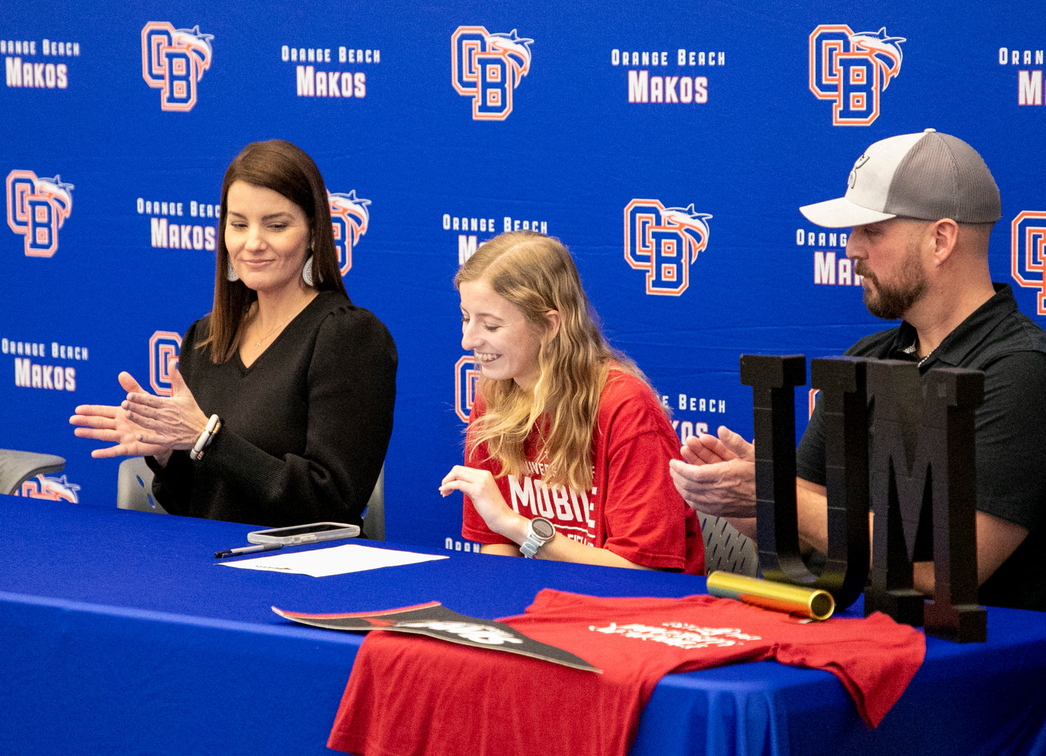 Claire Atkins took a moment to thank those who came to the Jan. 18 signing ceremony at Orange Beach High School where she penned her commitment to the University of Mobile cross country and track teams to mark the first Mako runner to extend her career into college.
