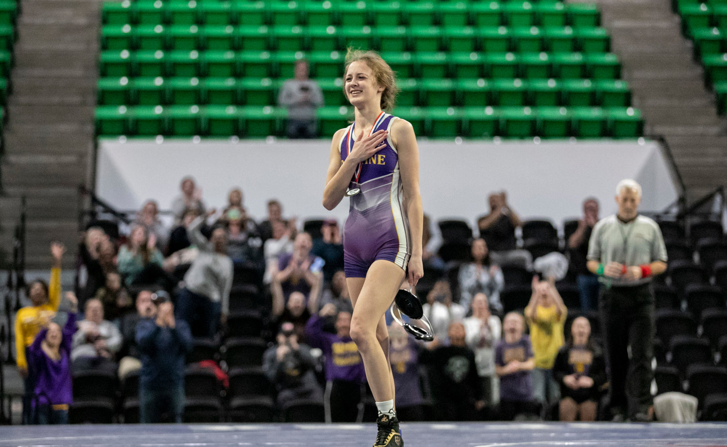 Daphne’s Alanah Girard walks off the mat as the 100-pound state champion after pinning Auburn’s Erin Clarkson in the first round of the finals at Bill Harris Arena in Birmingham Friday, Jan. 20. Girard helped the Lady Trojans finish as runners-up in the team competition following the two-day tournament.