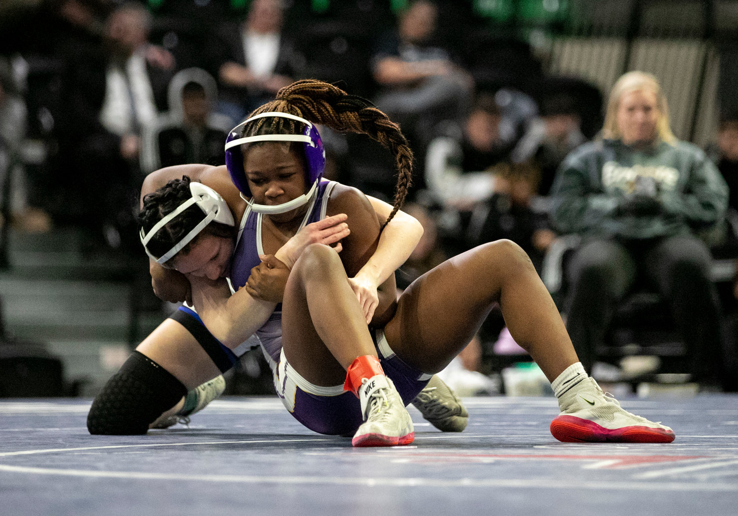 Daphne’s Kalyse Hill battles with Tuscaloosa County’s Raya Carpenter in the 132-pound championship match Friday, Jan. 20, at Bill Harris Arena during the girls’ wrestling state finals. Hill grabbed her second straight individual state championship to help the Lady Trojans finish as runners-up in the team competition.