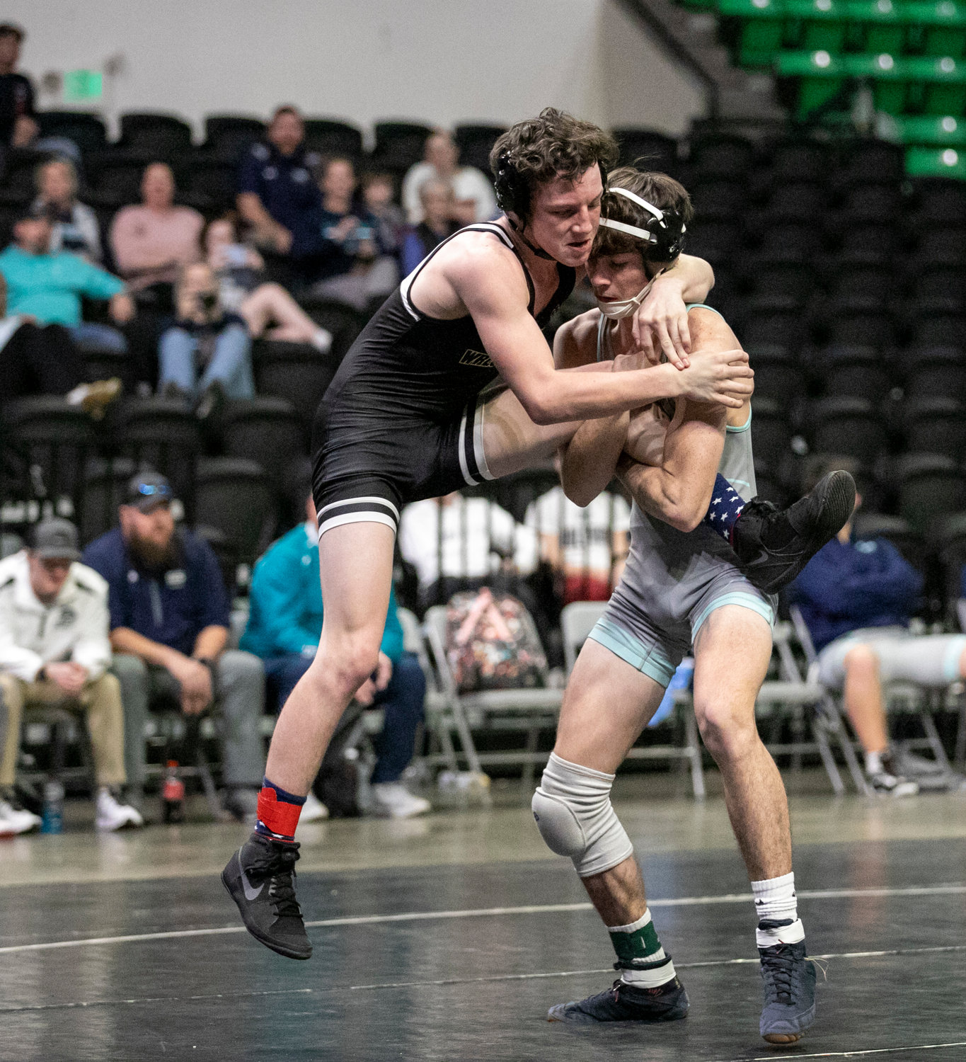 Dathan Butt looks for a take down of Hayden’s John Kelly in the opening match of the dual consolation finals in Birmingham Friday night. Butt earned a major decision, 11-1, to get things rolling for Gulf Shores.