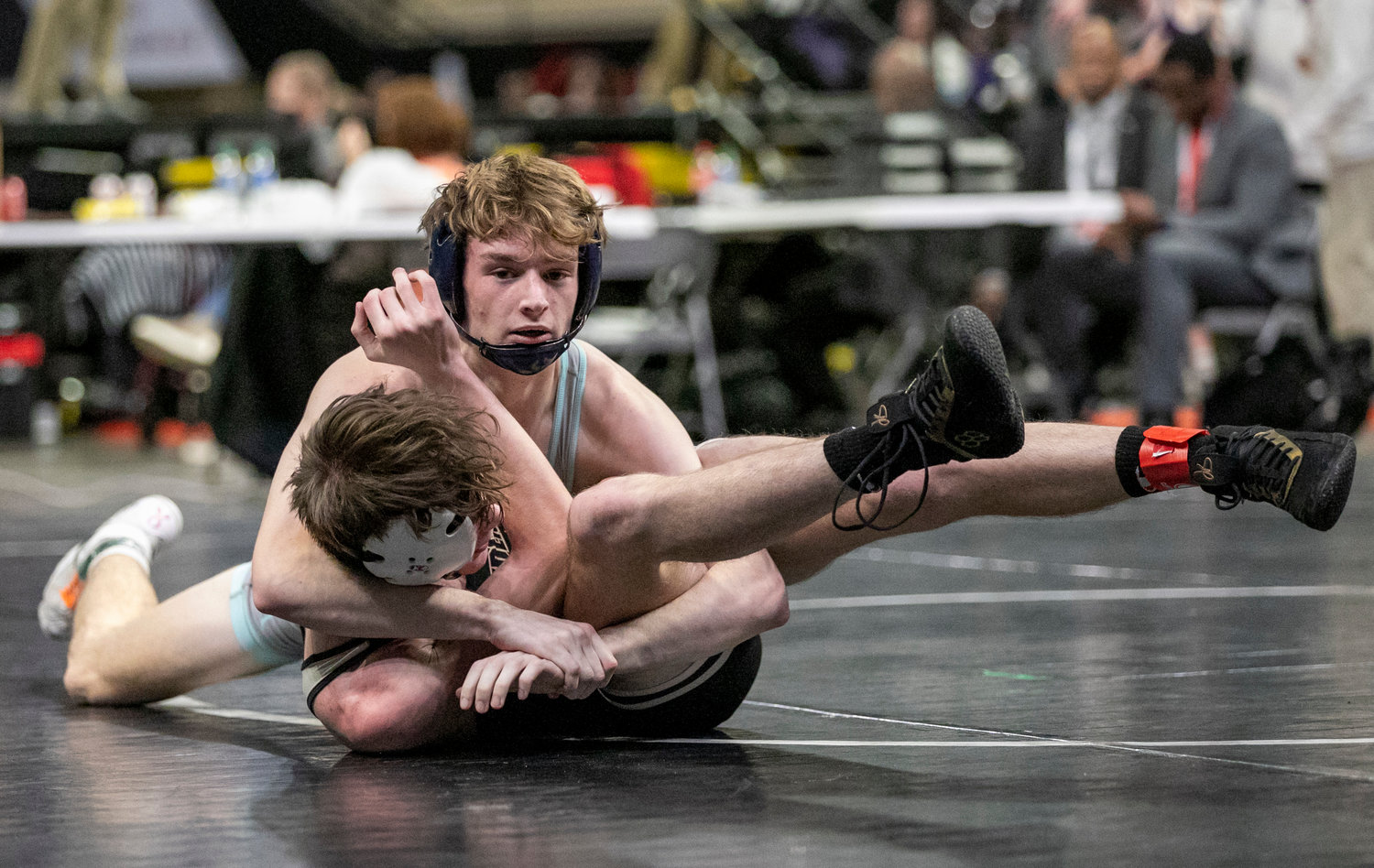 Gulf Shores junior Ethan Sharkey pulls together a head lock during the 134-pound match for the dual consolation finals at Birmingham’s Bill Harris Arena Friday, Jan. 20. Sharkey earned a 10-8 decision to score points for the Dolphins against the Hayden Wildcats.