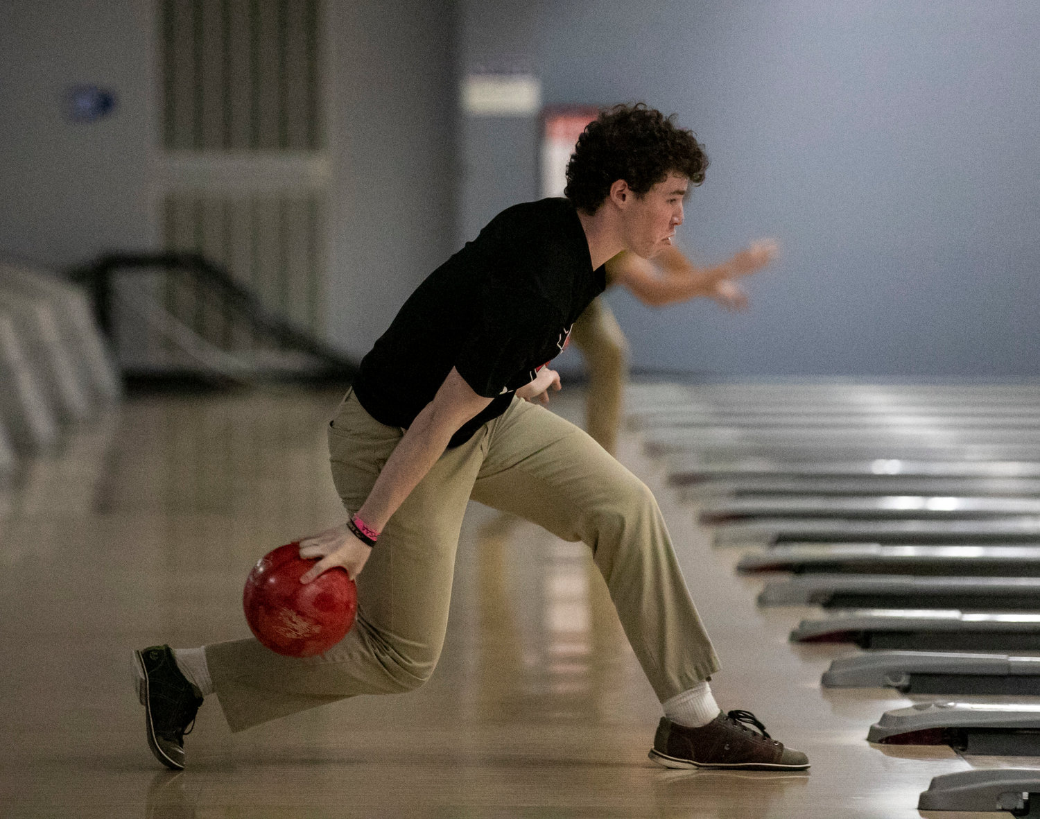Spanish Fort sophomore Cameron Lytle loads a shot in the qualifying round of action during the South Regional bowling tournament Thursday, Jan. 19, at Eastern Shore Lanes. Lytle helped the Toros finish as regional semifinalists to move on to the state tournament next week.