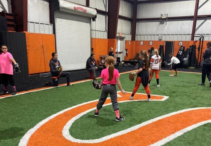 Although rain moved Saturday’s softball clinic inside, young athletes from Bay Minette took advantage of learning from current Baldwin County Lady Tigers and participated in several different drills.