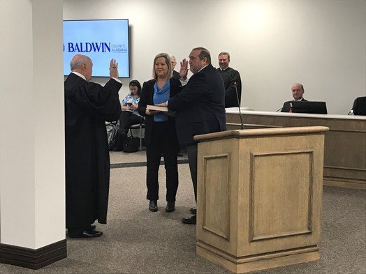 Baldwin County Coroner Brian Pierce takes the oath of office to start his new term. Pierce, Sheriff Huey "Hoss" Mack and Circuit Judge Scott Taylor were sworn in for new terms during Jan. 17 County Commission meeting.
