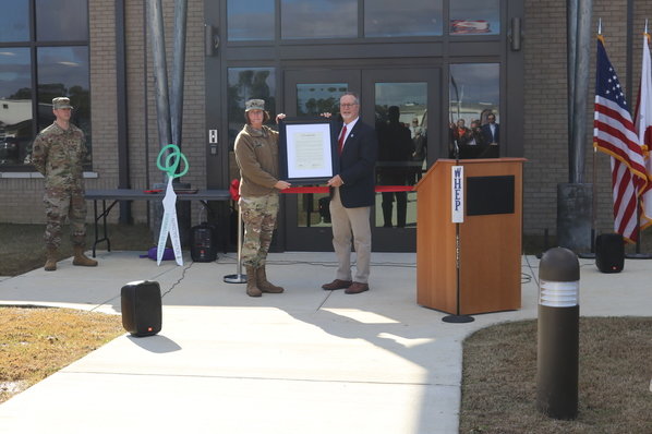 Alabama National Guard adjutant general, Maj. Gen. Sheryl Gordon, presents a plaque to Foley Mayor Ralph Hellmich recognizing the city's support in the effort to built the new 30,540-square-foot National Guard armory. The center was dedicated Monday, Jan. 23.
