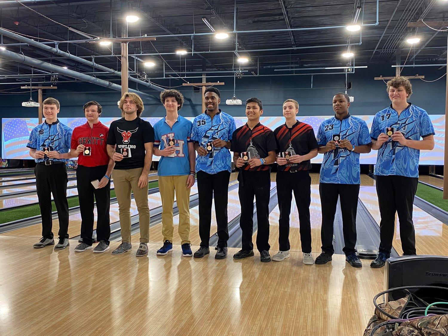 Anthony Passarelli, third from left, brought an individual medal back to Spanish Fort after his seventh-place finish in the qualifying round of the AHSAA bowling state championship Thursday, Jan. 26, in Gadsden.