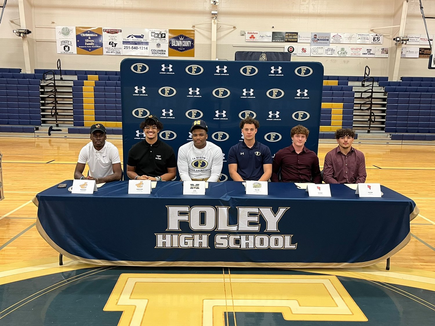 Six Foley Lions put pen to paper to celebrate National Signing Day during a Feb. 1 ceremony at the high school. Harrison Knight and Cameron Schultz signed with Jones College, AJ Prim is headed to Mississippi Gulf Coast, Reece Tynes penned a commitment to Independence College and Tyler Hamby and Isaac Gamez will remain teammates at Birmingham Prep.