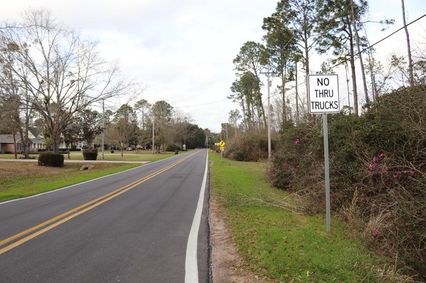 A new sign states that trucks are not allowed on Clarke Ridge Road. The Baldwin County Commission voted to prohibit trucks on the residential street after hearing complaints that heavy vehicles were damaging the road.