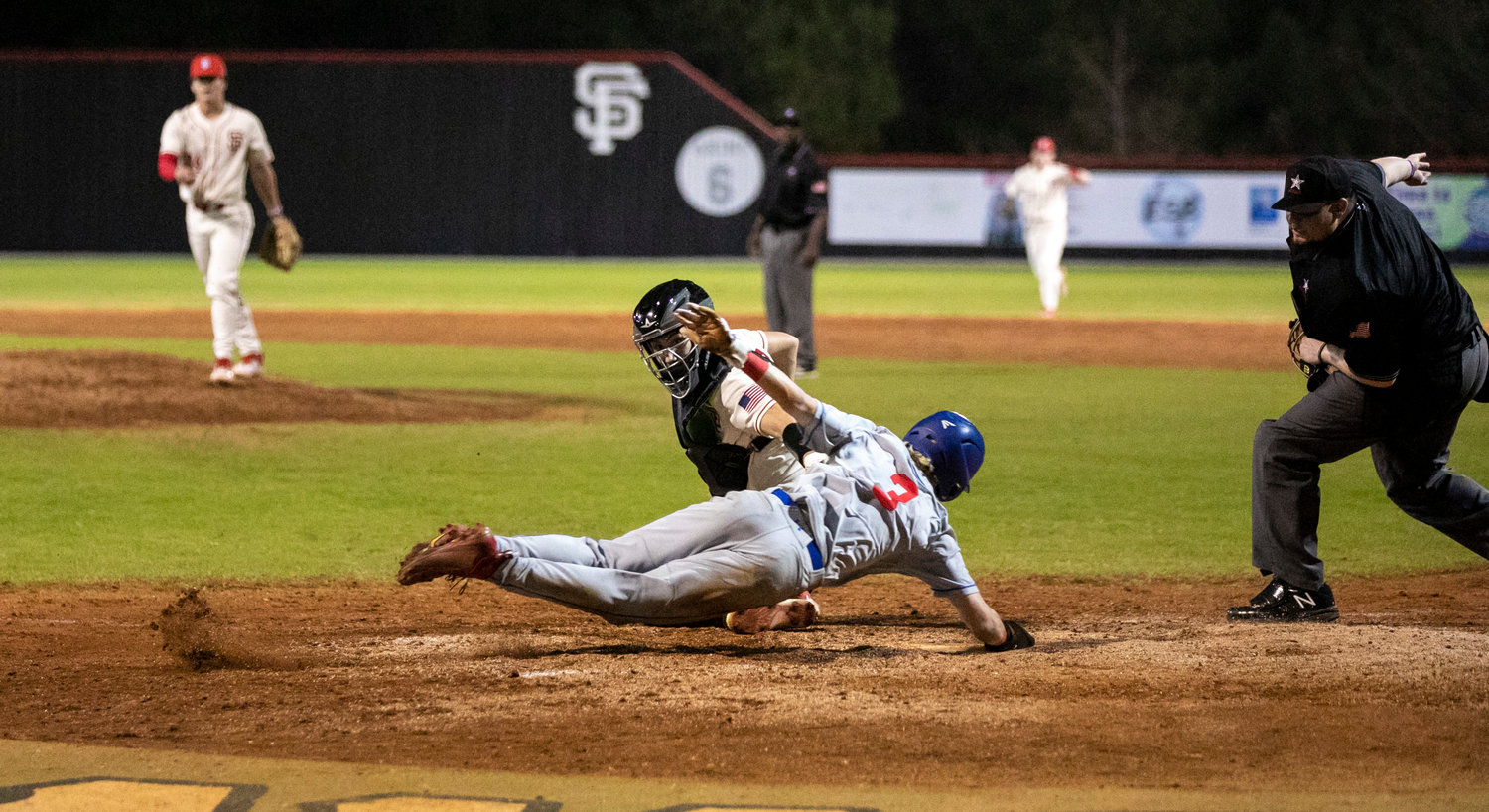 Toro catcher DJ Eurgil reaches to apply a tag on St. Paul’s 3 for an inning-ending double play during Thursday’s Opening Day contest at Spanish Fort High School. The hosts emerged victorious with a 7-4 win after they trailed 4-1 early in the game.