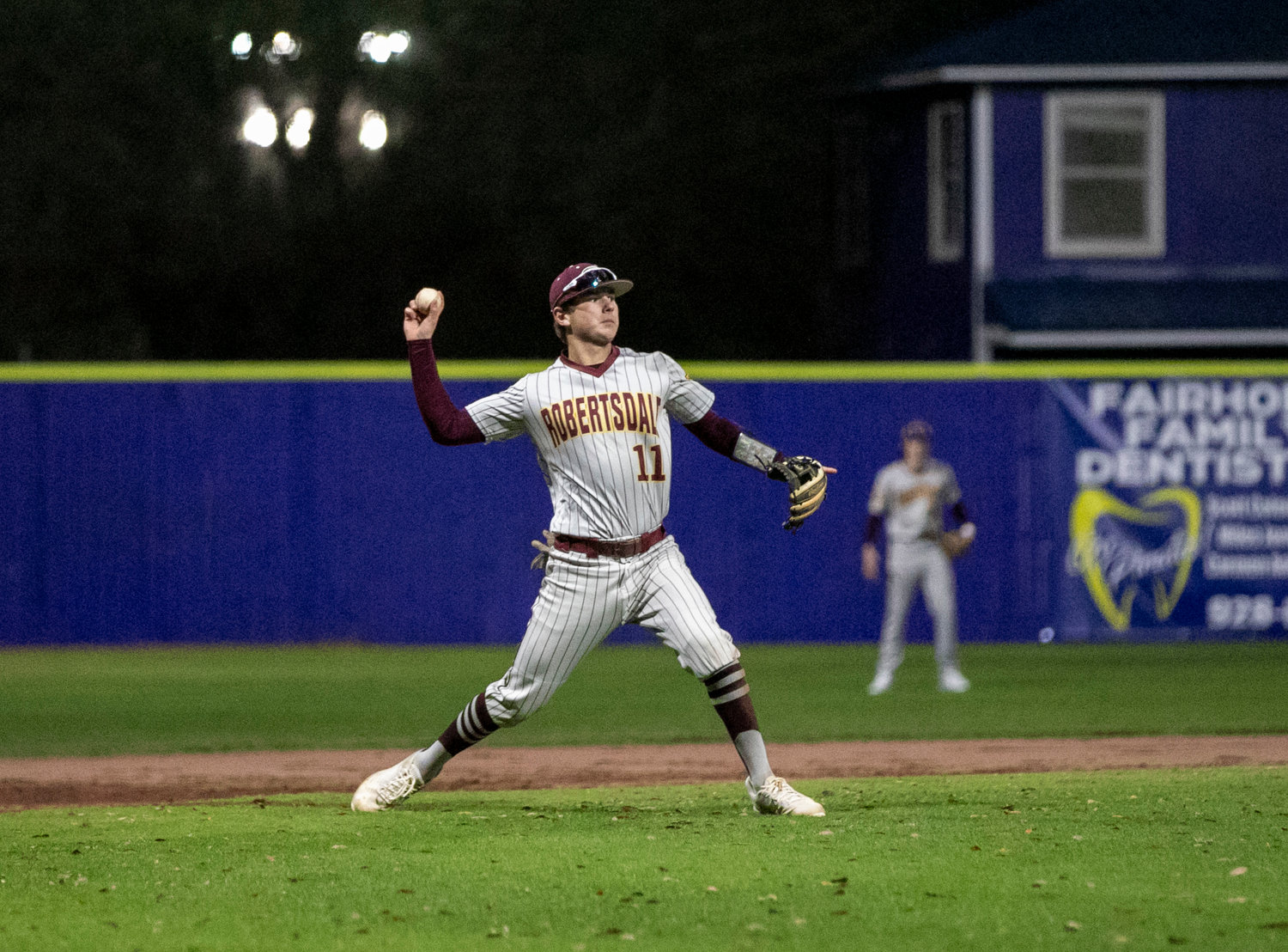Golden Bear third baseman Ethan Parnell loads up a throw across the diamond for an out in the fourth inning of Robertsdale’s Friday away game against the Fairhope Pirates at Volanta Sports Park.