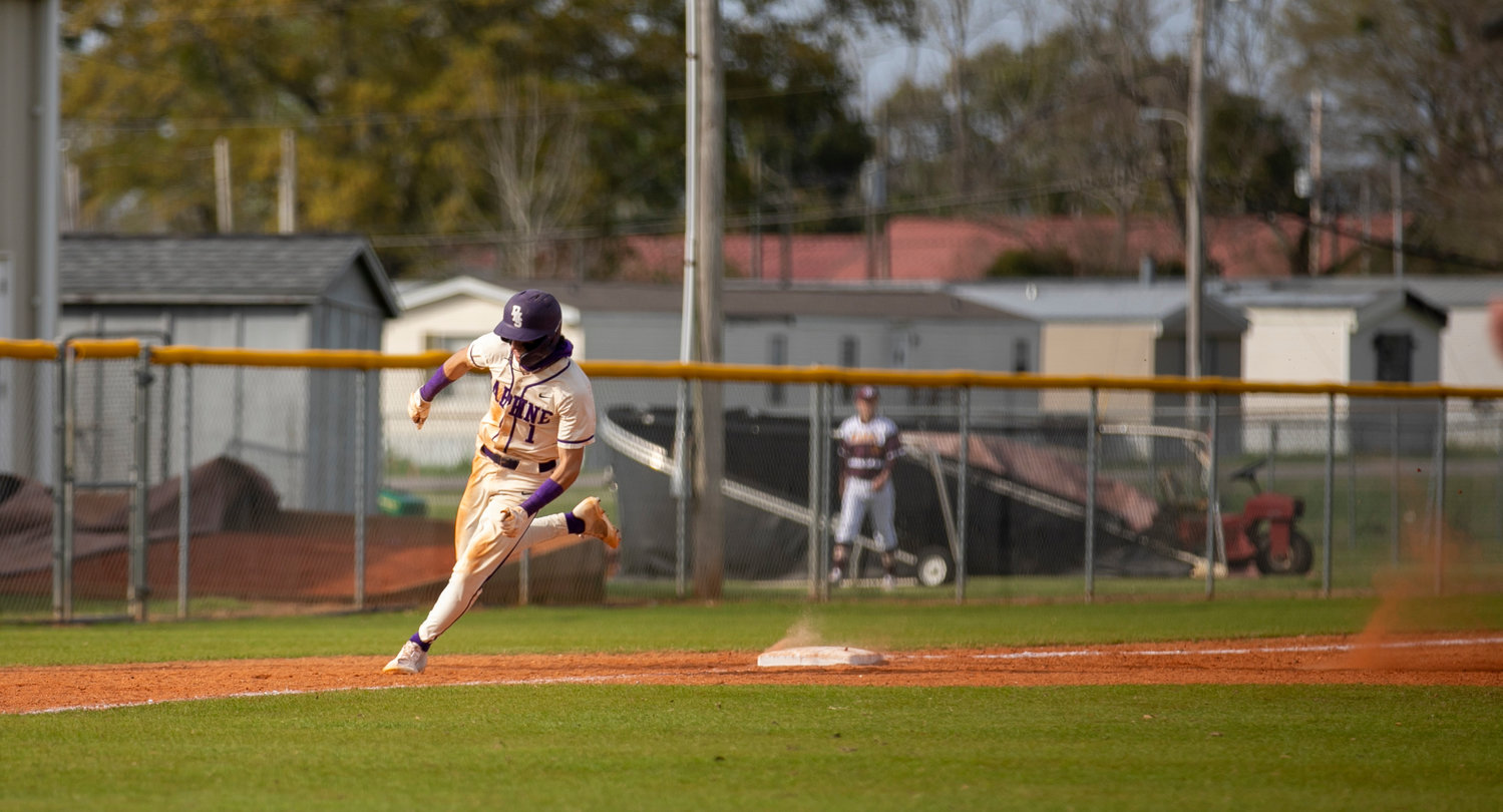Trojan freshman Steele Hall races around third base on a sixth-inning hit against the Tuscaloosa County Wildcats at the Prep Baseball Report South Alabama Showdown in Robertsdale Saturday, Feb. 26. Hall had previously provided the go-ahead, two-RBI double that helped lift Daphne 6-3 where he also recorded the save on the mound.