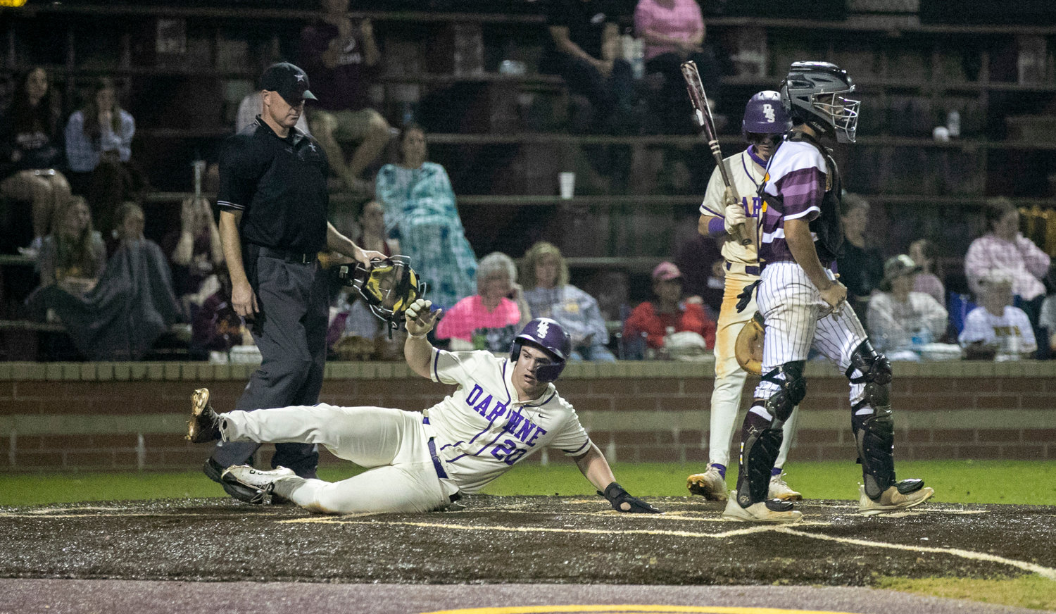 Daphne junior Nic Cox slides into home with one of five runs the Trojans scored in their fifth inning of Saturday’s non-region game against the Robertsdale Golden Bears on the road during Prep Baseball Report’s South Alabama Showdown.