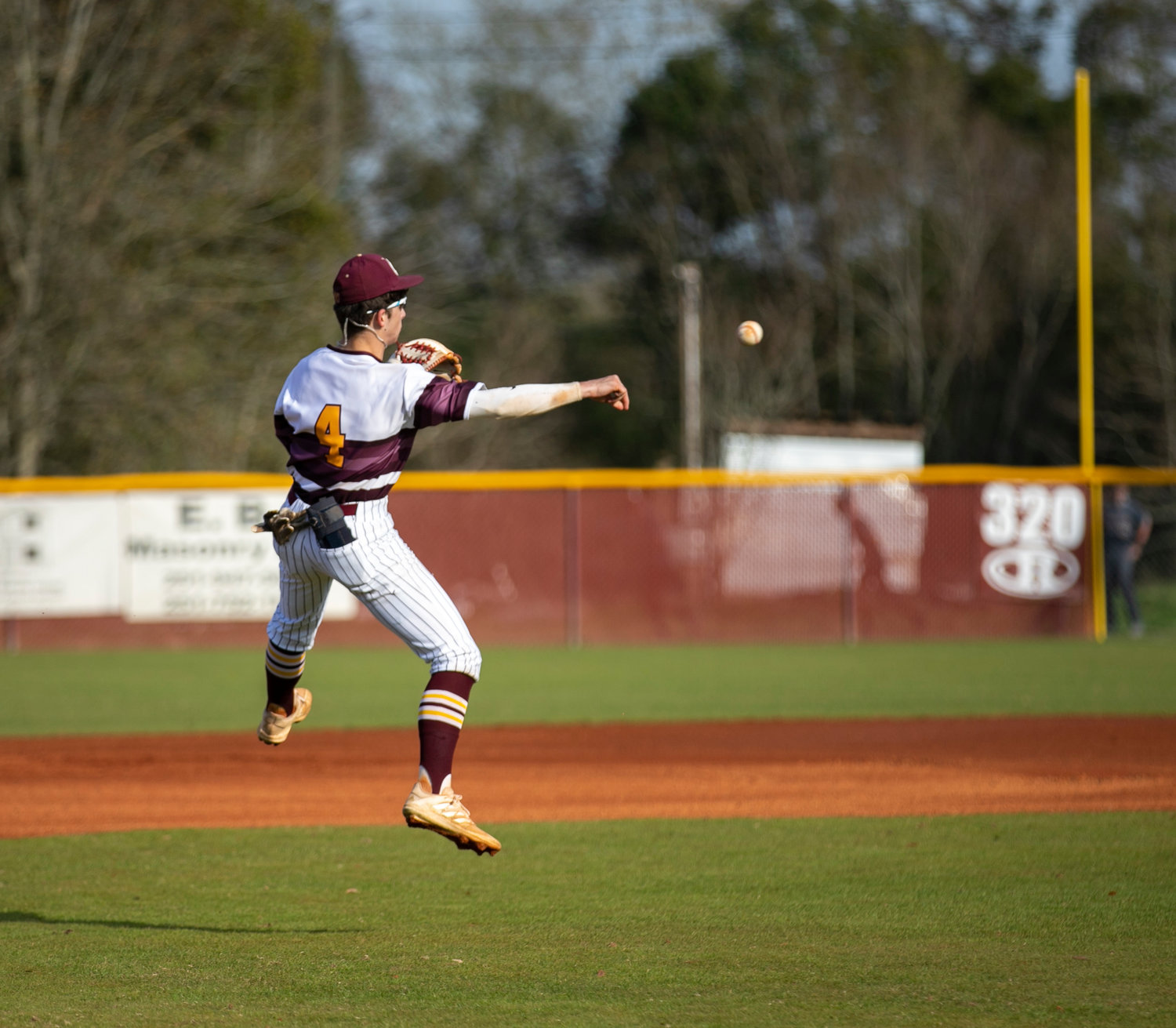 Robertsdale junior Taylor Jordan fires a throw to first for an out in the Golden Bears’ South Alabama Showdown game against the Fairhope Pirates at home Saturday, Feb. 26.