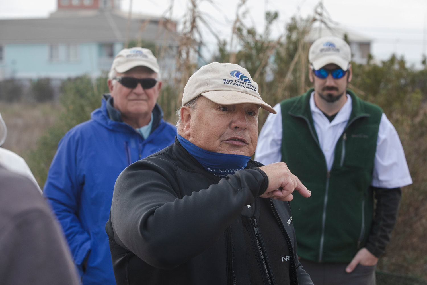 Navy Cove Oysters founders John Supan and Charles Wilson along with partner Eric Bradley speak to a tour group at their farm in mid-January.