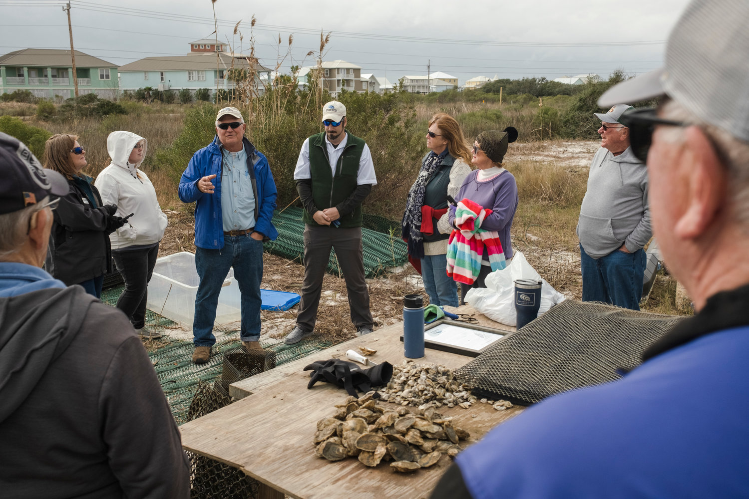 Navy Cove Oysters founder Charles Wilson and partner Eric Bradley explain their farming process to a small tour group in  mid-January.
