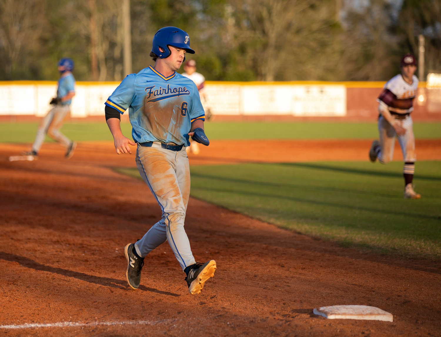 Jackson Hatcher pulls into third on a base hit from Harrison Sparks during the Fairhope Pirates’ South Alabama Showdown contest against Robertsdale on the road Feb. 25.