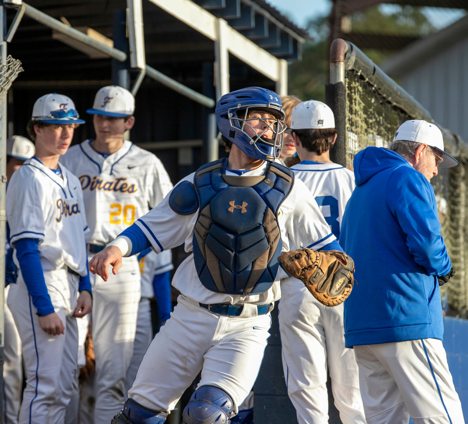 Fairhope’s Hollon Brock emerges from the dugout for Opening Day lineup announcements Friday, Feb. 17, at Volanta Park for the Pirates’ game against Robertsdale. After he announced his pledge to join the LBW Saints in December, Brock signed his National Letter of Intent last Sunday.