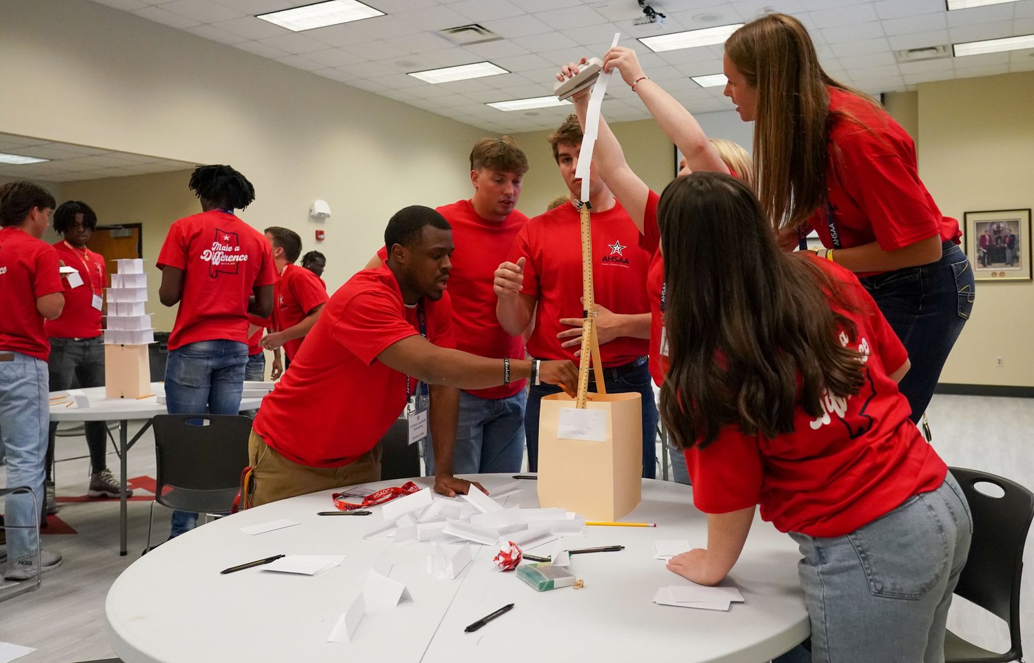 Bailey Hope (top right) works with fellow student-athletes in a team-building exercise last week at AHSAA headquarters during their annual Student Leadership Conference. Hope served as Spanish Fort’s first selection to attend the meeting.