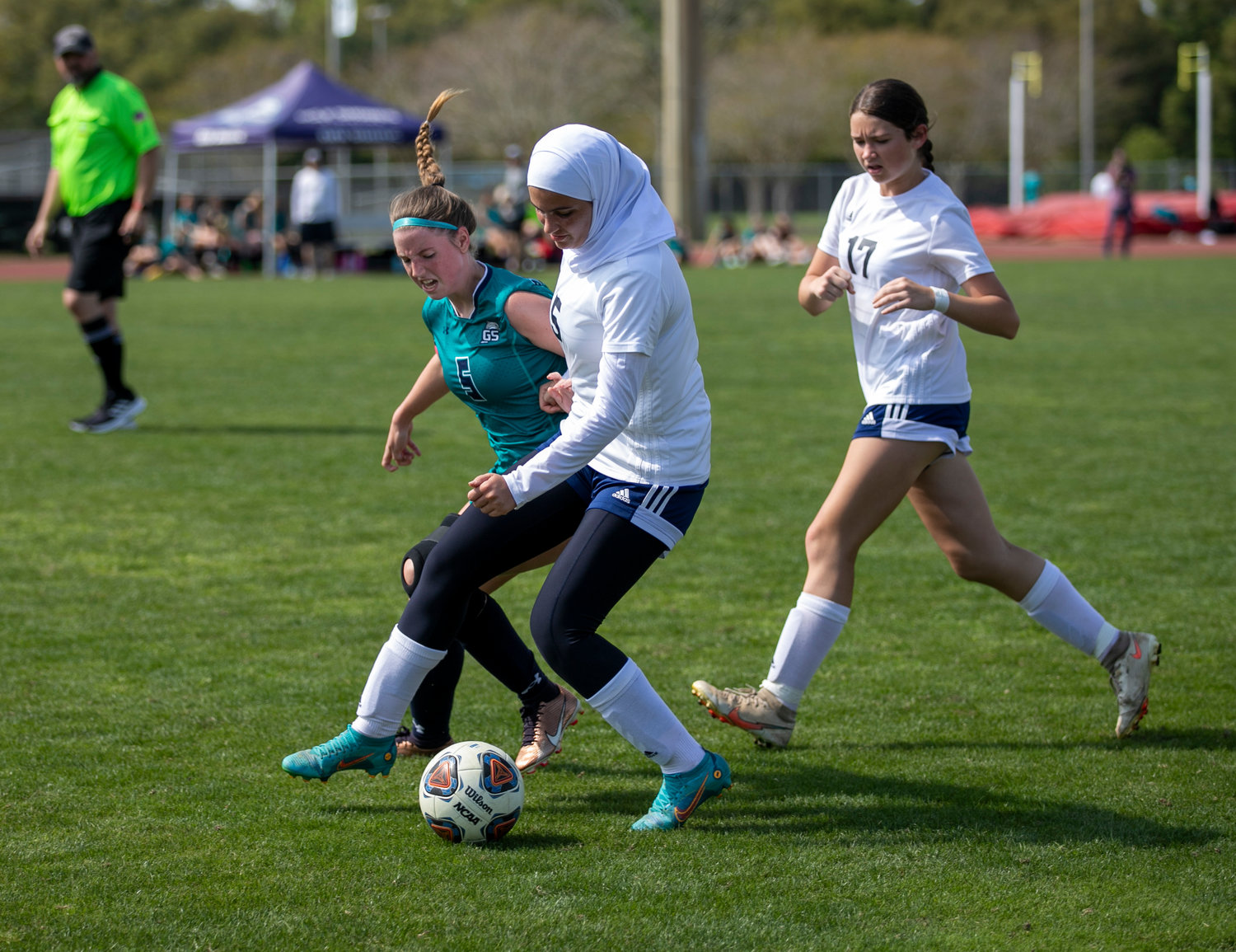 Dolphin senior Calista Sweet battles Baker junior Sarah Shabaneh for positioning in the second half of the girls’ gold final Saturday, March 11, at the Gulf Shores Sportsplex during the Island Cup tournament. The Hornets emerged victorious with a 2-0 win to close action.