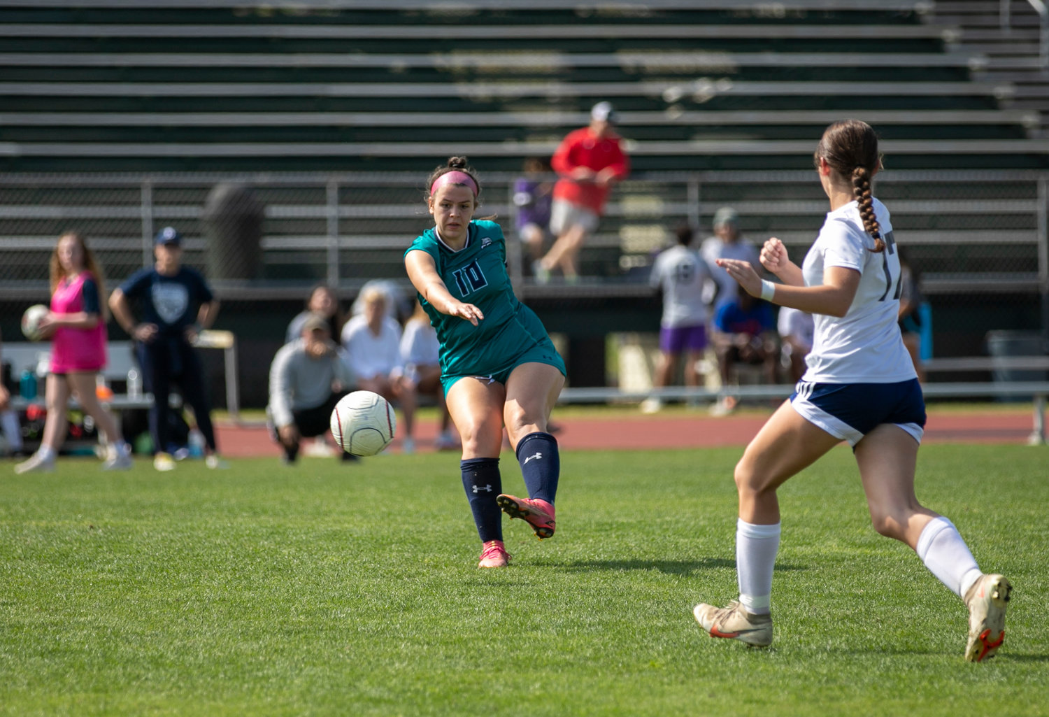 Dolphin senior Jensen Ward sends a ball into the offensive end during Saturday’s gold final match against the Baker Hornets at the Gulf Shores Sportsplex as part of the annual Island Cup. The Belhaven commit helped the Dolphins earn shutout wins over Austin and Moody in Friday’s action.