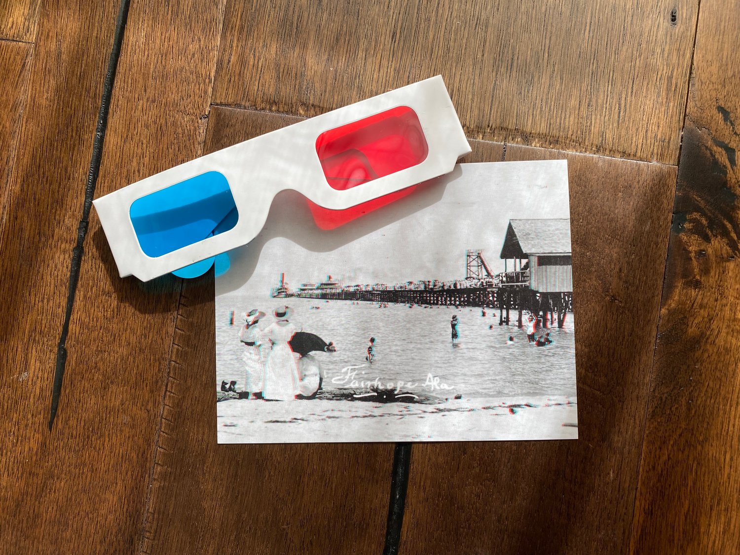 After visiting the "Visions of a Fairhope" exhibit keep your 3D glasses and grab a free postcard to share the experience with a friend.