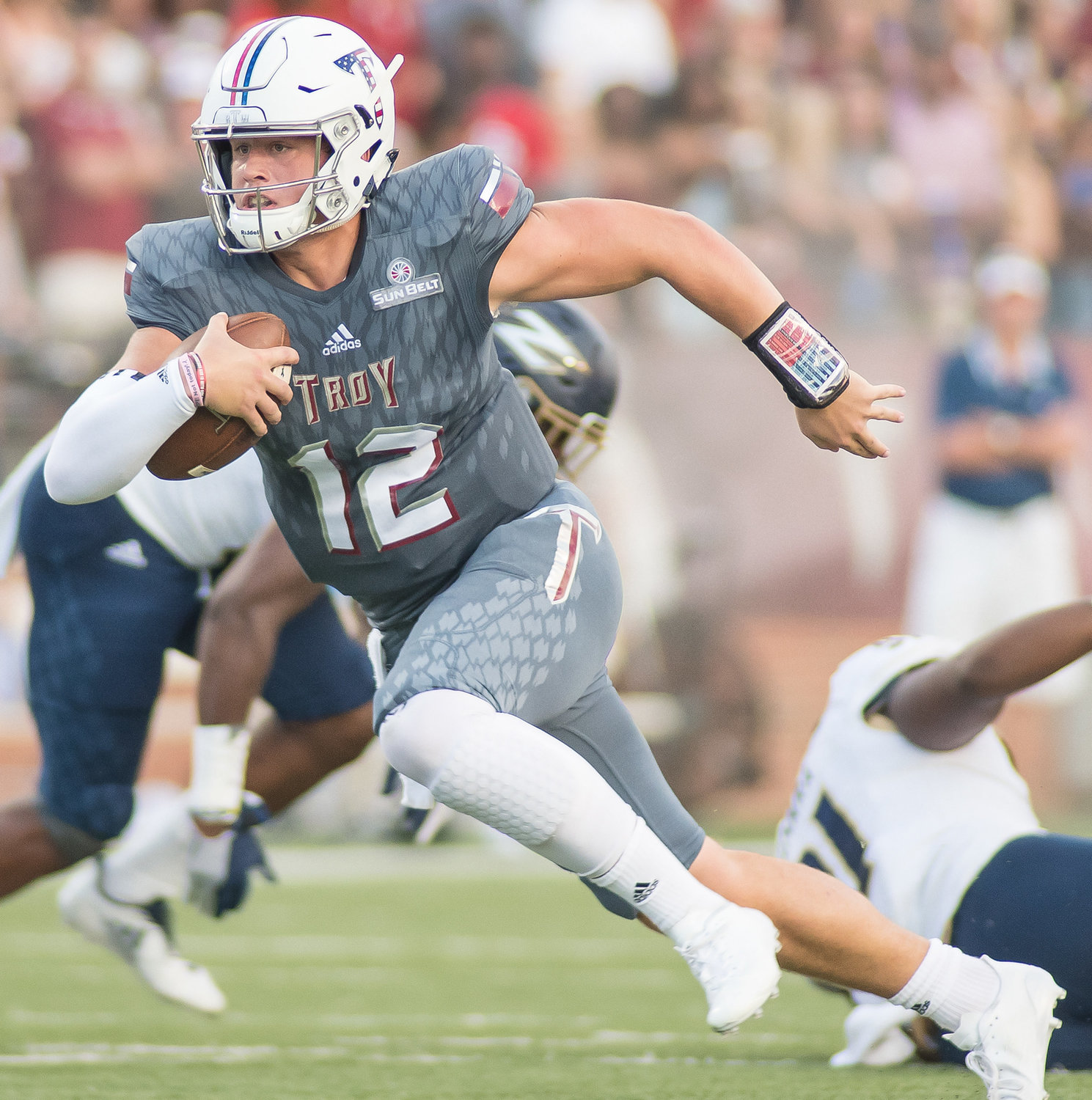 Troy’s Brandon Silvers escapes the pocket and hits the open field during the Trojans’ contest against the Akron Zippers at home Sept. 23, 2017. Sun Belt Conference records for completions, passing percentage and total touchdowns responsible for are still owned by the Gulf Shores Hall of Famer Silvers.