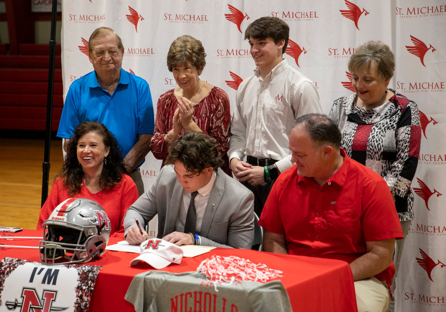 St. Michael senior Justin Helper was joined by his family in celebrating his signing with the Nicholls State football program Monday, March 27, at the high school. Helper finished his senior season with 50 tackles, 14 pass breakups, 3 forced fumbles and 2 blocked field goals.