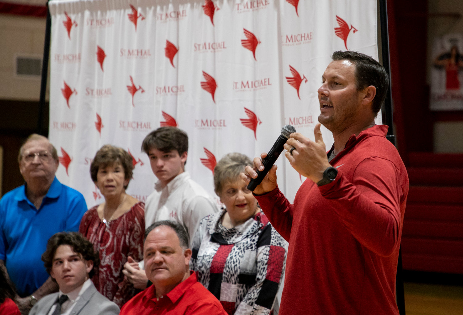 Cardinal head football coach Philip Rivers speaks during Monday’s signing ceremony at St. Michael Catholic where Justin Helper penned his commitment to the Nicholls State Colonels. Helper marked the third member of the 2022 Cardinal defense to sign with college teams after Clay Barr (Delta State) and Tyler Cella (Benedictine) signed Feb. 1.