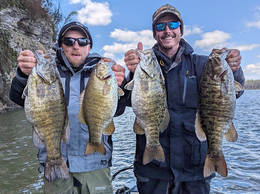 Mason's clients displayed several of the big smallmouth caught on the Tennessee River lakes in Alabama.