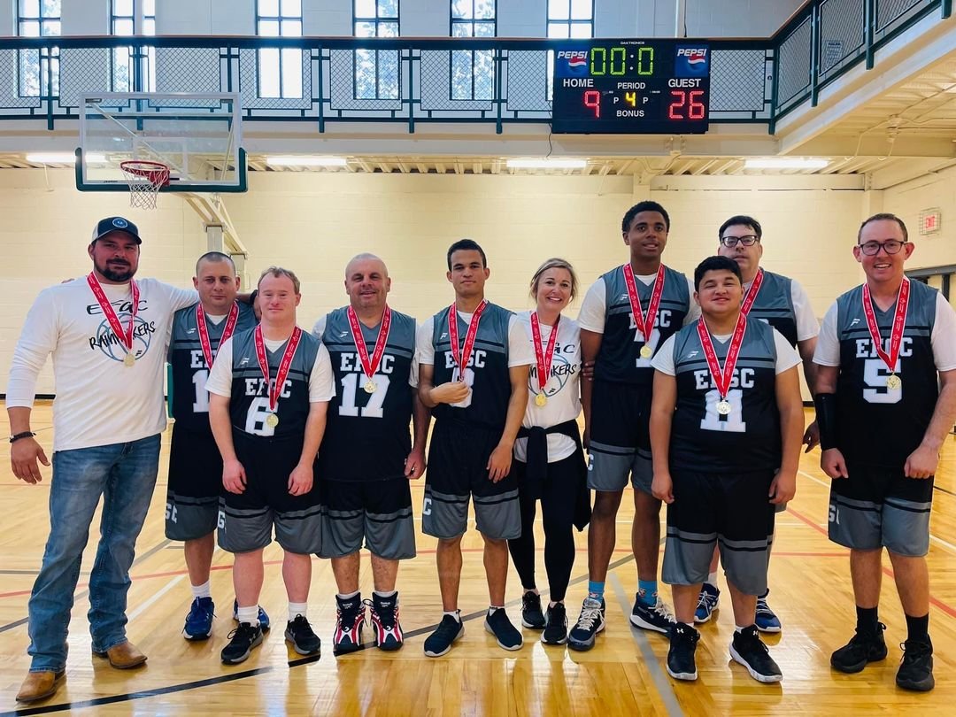 The Rainmakers from the Exceptional Foundation Gulf Coast in Daphne claimed the basketball championship at the Alabama State Special Olympics in Montgomery March 10. Pictured from left to right are Coach Adam Harmeier, Kelby Sanders, Tal Sudduth, Neil Frazier, Zachary Schrock, Coach Candice Dodson, Isaiah Featherston, Huey Baxter, Jerry Wise and Jarrett Helm.
