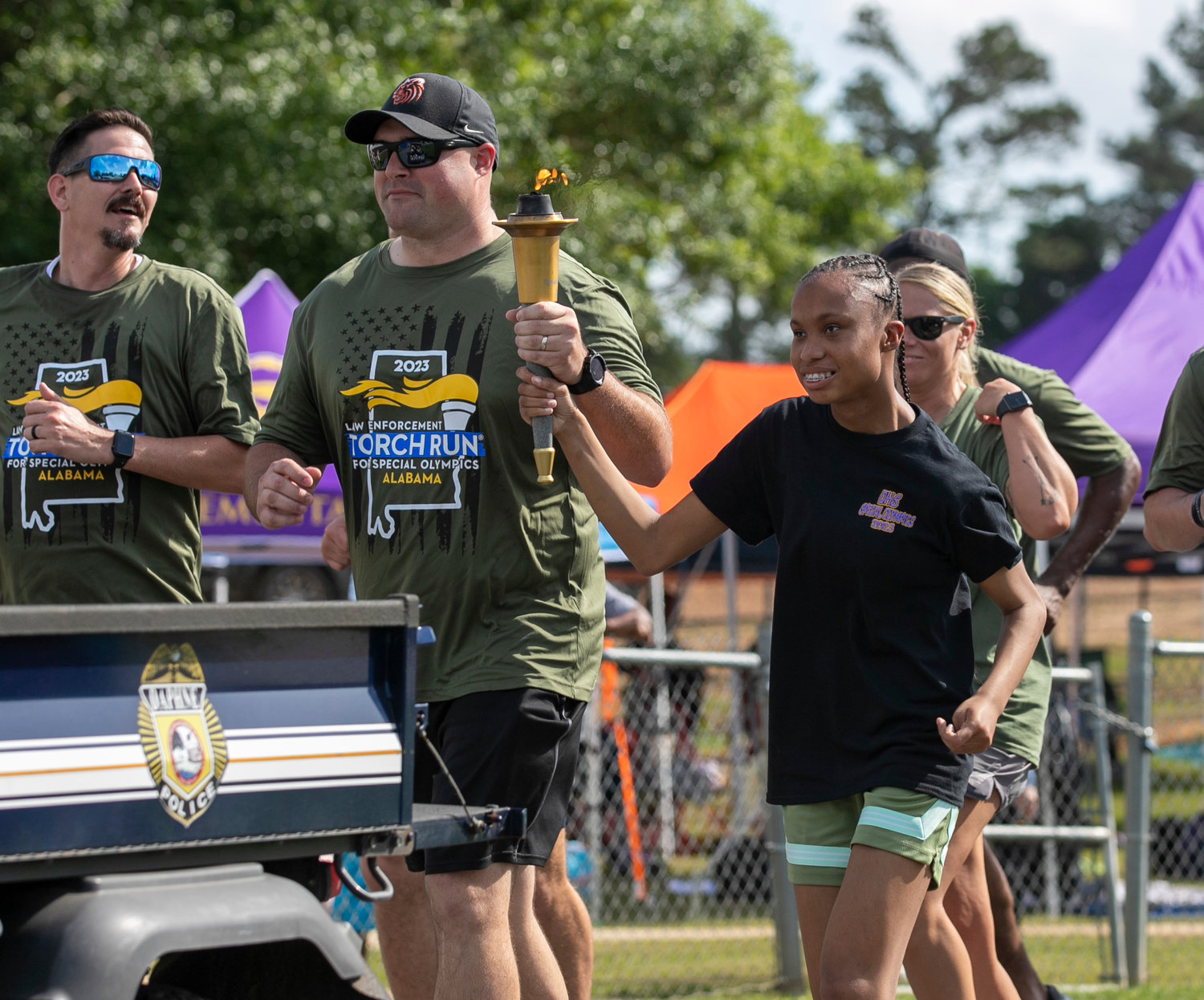 JaMaya Smith from Daphne High School runs the anchor of the torch run relay which closed Thursday’s opening ceremonies at the Baldwin County Spring Games in Fairhope.