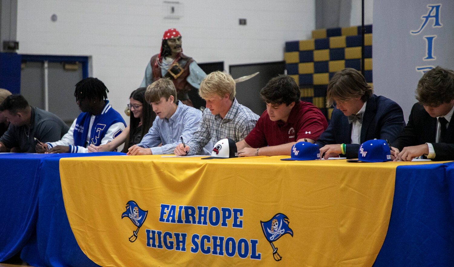 A group of 17 student-athletes from Fairhope High School signed National Letters of Intent Monday, April 17, during a ceremony in the gymnasium. Among the signees included, from left, Qualin McCants, Michelle Bossard, Zachery Wyatt, Brooks Brasfield, Jacob Conway, Hollon Brock and Jackson Hatcher.
