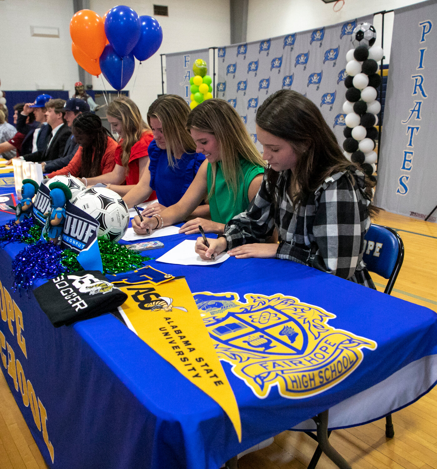 Madeline Dicksey and Emily and Addison Smith represented the Pirate soccer team at Monday’s signing ceremony in Fairhope where 17 student-athletes cemented college commitments. Dicksey is headed to Alabama State and the Smith twins are taking their talents to West Florida.