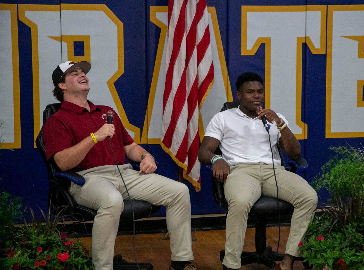 Jacob Conway laughs during his interview with Preston Godfrey on Pirate Nation Live following the signing ceremony in the gymnasium Monday, April 17. Conway signed the commitment he made to the Mobile baseball squad last fall.