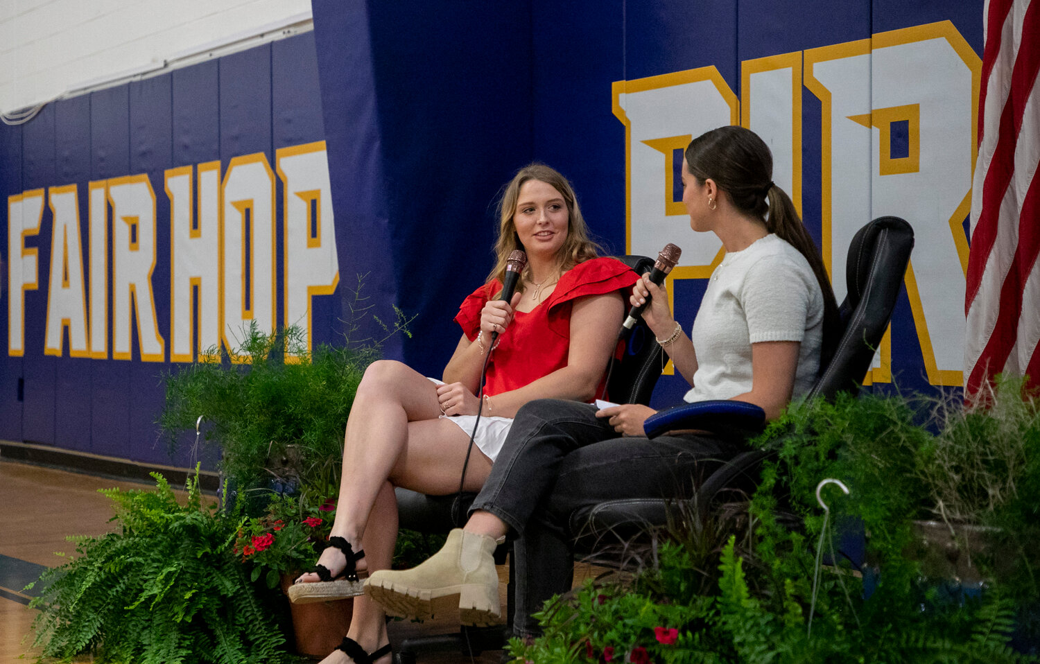 Fairhope senior Ryley Harrison is interviewed by Pirate junior Murphy Creel after April 17’s signing ceremony in the gymnasium. Harrison signed with the South Alabama softball squad as one of 17 student-athletes who penned college commitments.
