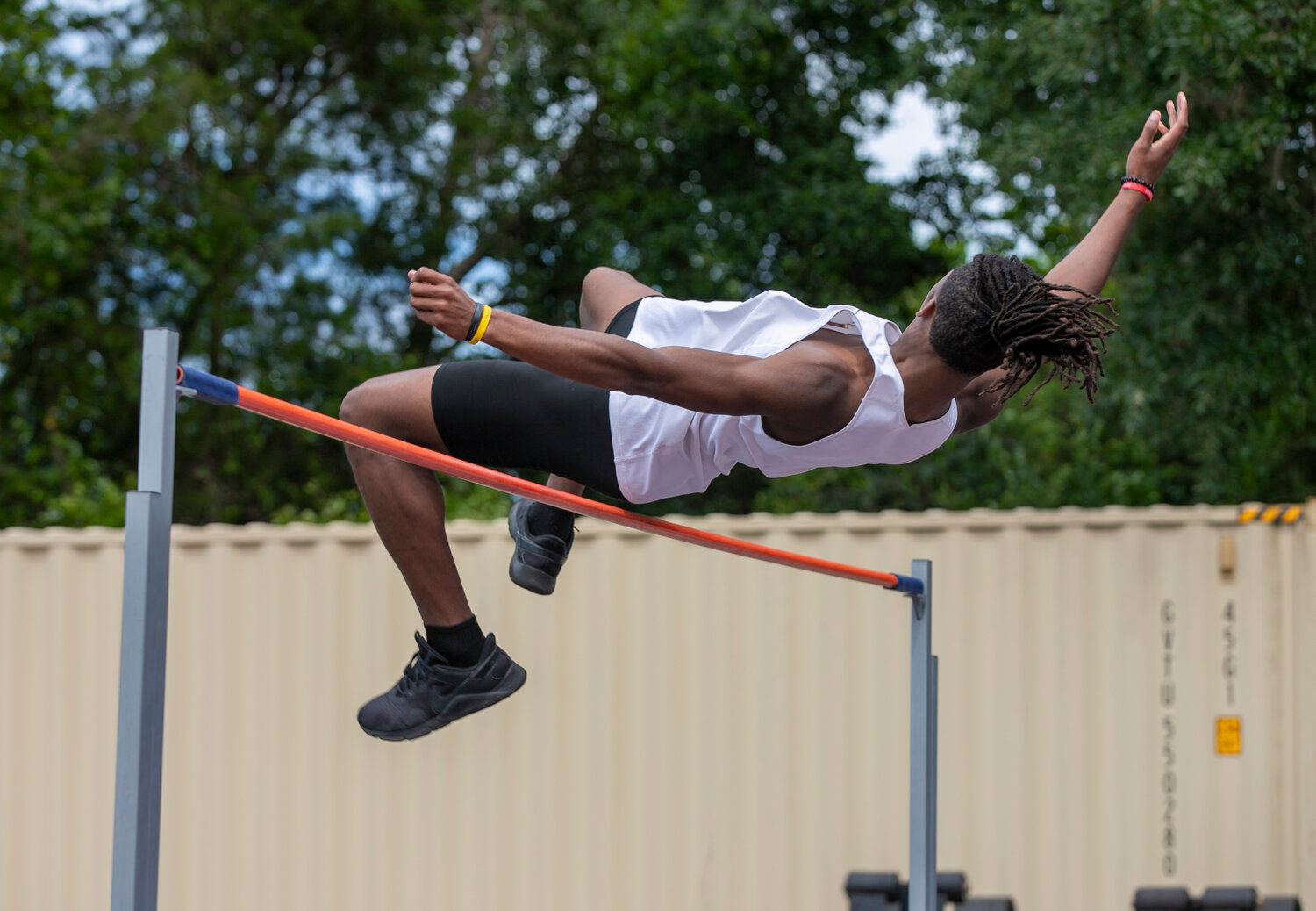 Daphne sophomore Cayden Williams clears 5’ 8” in the high jump competition Tuesday afternoon at Jubilee Stadium during the Baldwin County track and field championship meet. Williams went onto clear 6’ and win the event for the host Trojans.