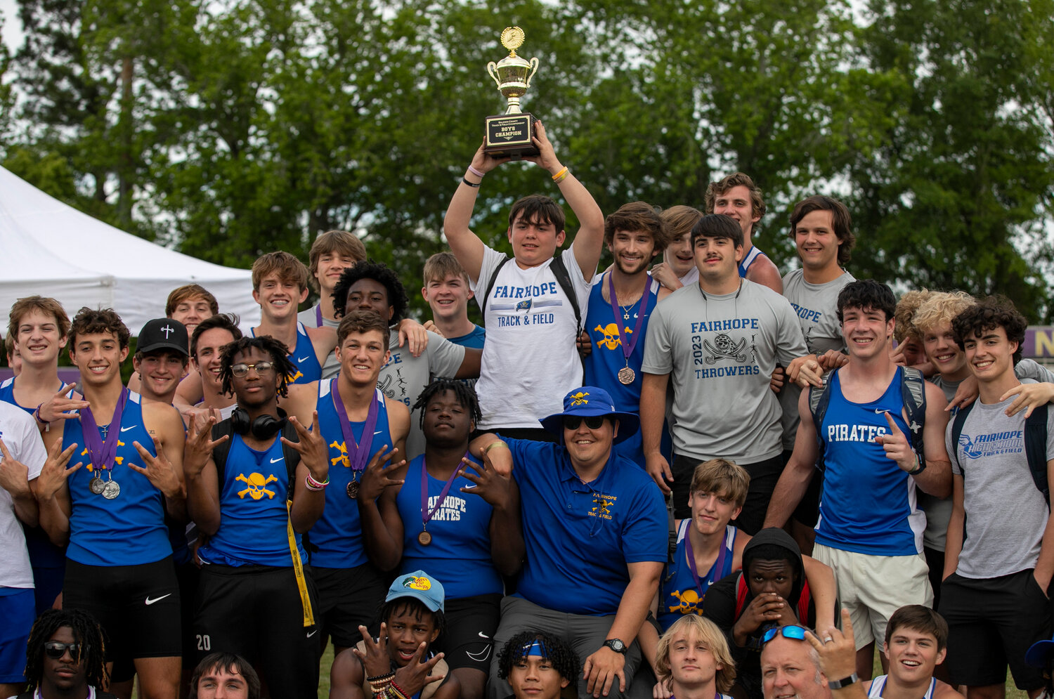 The Fairhope Pirate boys’ track team took over the podium after they received their trophy for winning the team competition at the Baldwin County Public Schools track and field championship meet Tuesday, April 18, in Daphne. Junior Ben Klapp earned four podium finishes to help his team rack up 21 total top-three spots and was named the most outstanding male performer.