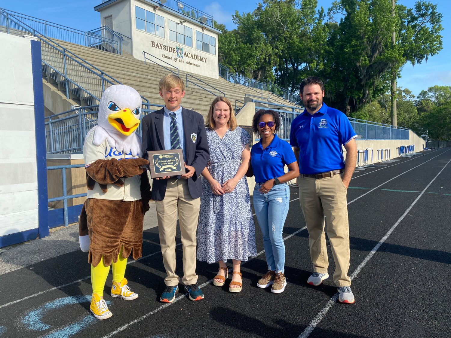 Sammy the Eagle from the United States Sports Academy was on hand at Bayside Academy Monday, April 17, to help recognize Ty Postle as a WKRG Scholar-Athlete. They are pictured with Melissa Postle, USSA’s Chair of Sports Exercise Science Dr. Katrina Wahlstrom and Admiral head track coach Joe Swagart.