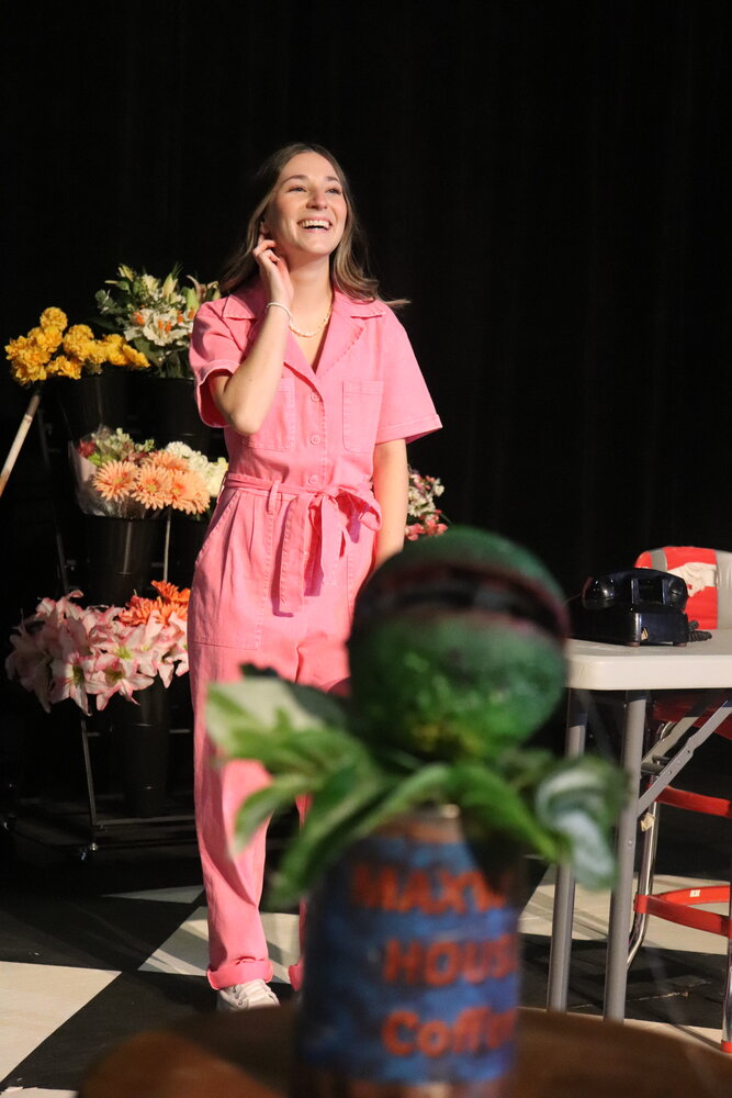 The flesh-eating plant, Audrey II, listens while Audrey, played by McKinley Carson, sings. Students at Spanish Fort High School will present "Little Shop of Horrors" this weekend.