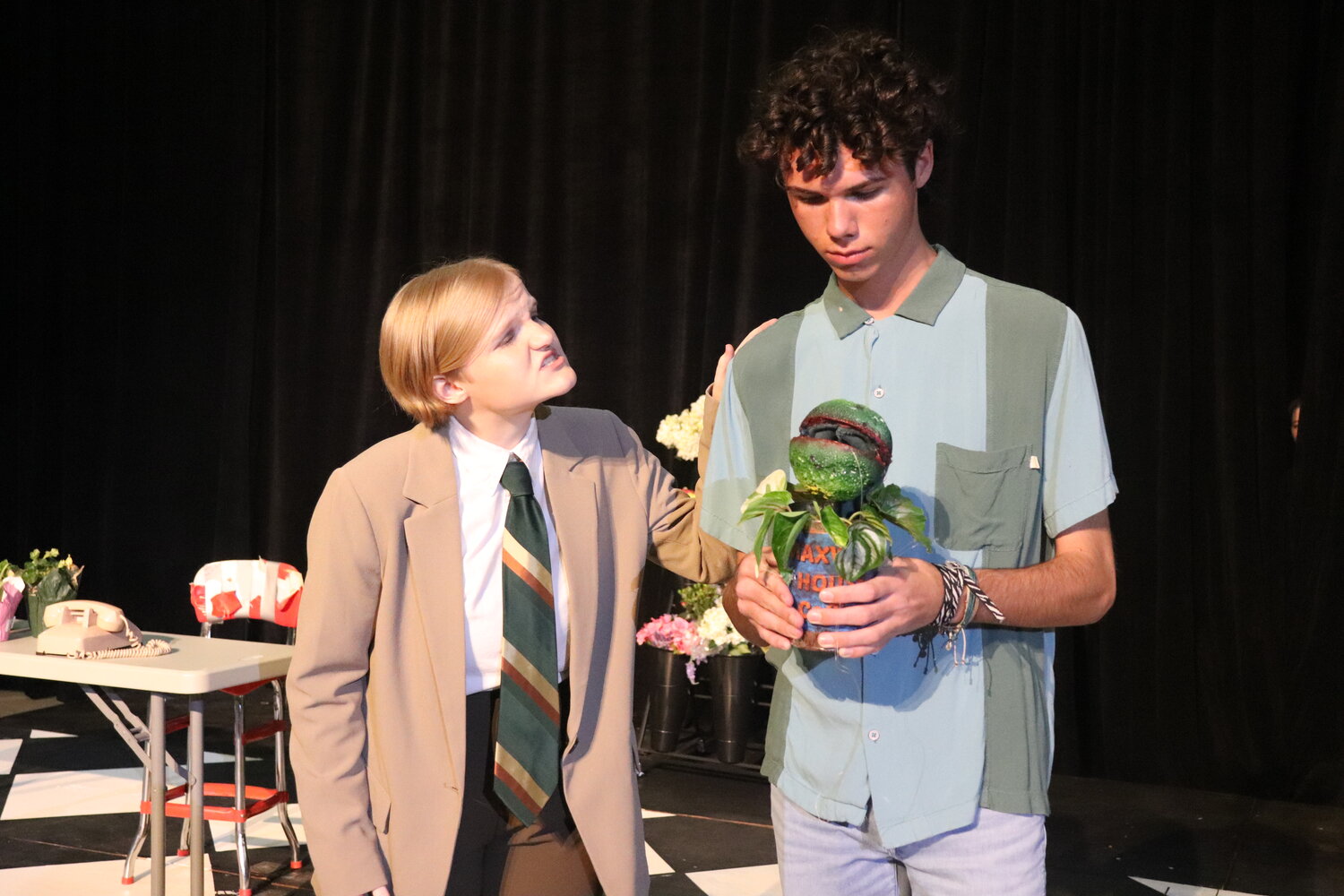 Meagan Nelson and Hayden Taylor rehearse a scene from the musical, "Little Shop of Horrors."