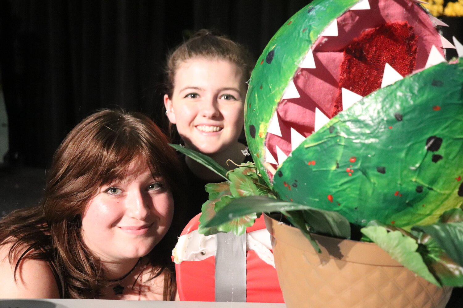 Spanish Fort High School students Aubrey Wilhite and Georgia Wilkins are the puppeteers for the vicious plant that is the center of the musical "Little Shop of Horrors."