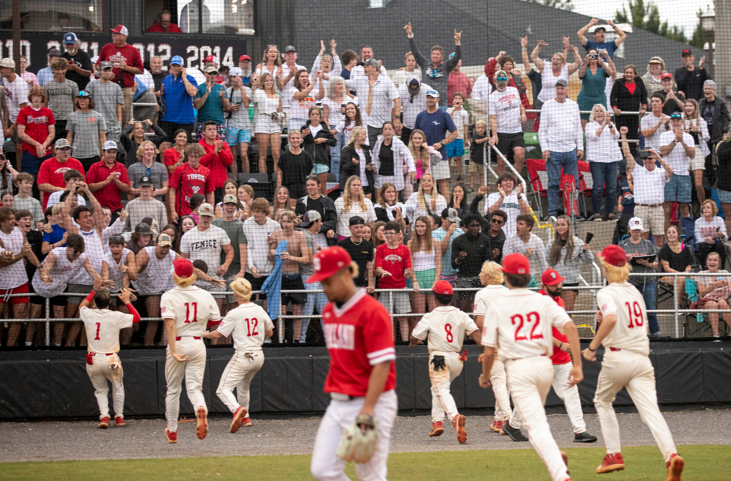 The Spanish Fort Toros race to celebrate with their student section following the 12-11, walk-off win over Saraland Saturday, May 6, on the Hill. Brayden Cooper came through with the hit that scored Newton Gardner in the eighth inning of Game 3 in the AHSAA state quarterfinal series.