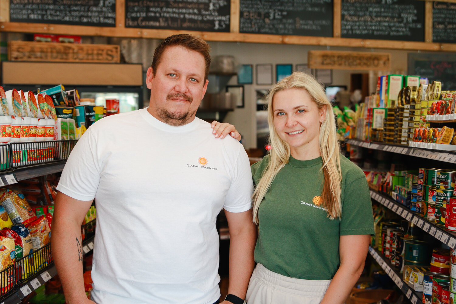 Owners of Gourmet World Market, Maksym Tsegelnyk (Left) and Iuliia Mulligan (Right), in store